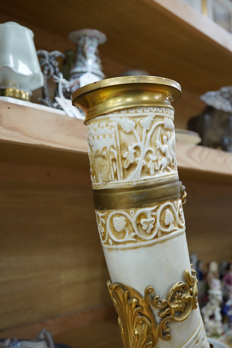 A late 19th century Viennese ormolu mounted ceramic drinking horn vase, 47cm high